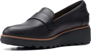 Clarks womens Sharon Gracie Penny Loafer, Black Leather With Dark Tan Welt, 5.5 US